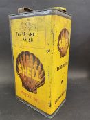 A Shell Motor Oil 'Triple Shell' grade gallon can.