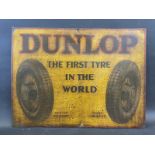 An early Dunlop 'The First Tyre in the World' part pictorial tin advertising sign, 28 x 21".