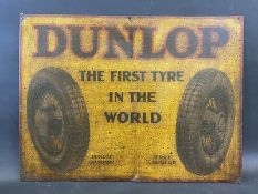 An early Dunlop 'The First Tyre in the World' part pictorial tin advertising sign, 28 x 21".