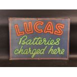 A 'Lucas Batteries Charged Here' rectangular tin advertising sign, 27 x 19".