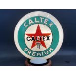 A Caltex TT Premium glass petrol pump globe by Webb's Crystal, chips to neck.