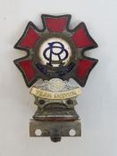 An Order of the Road enamel car badge with '59 Year Driver' attachment, by Spencer of London.