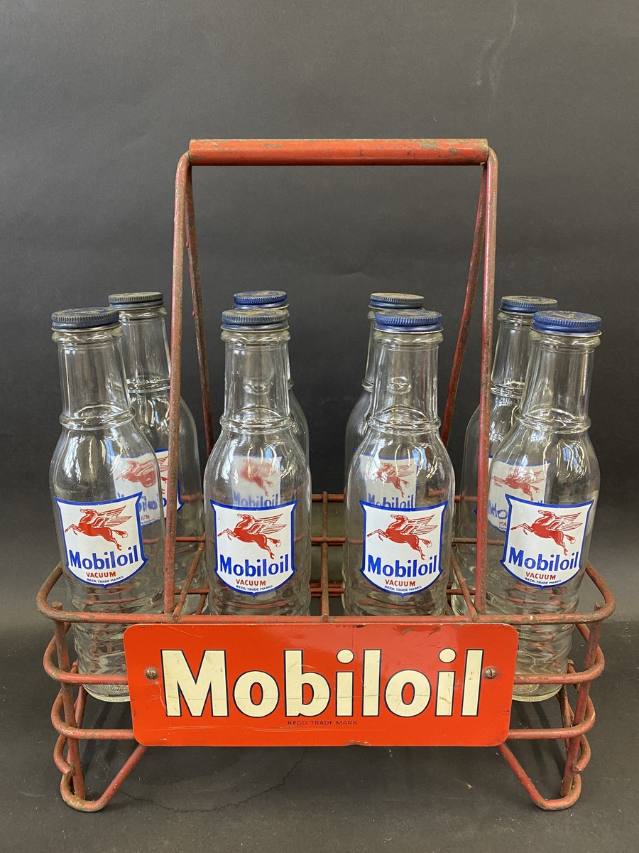 A good Mobiloil eight division oil bottle crate containing eight correct bottles with good labels
