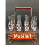 A good Mobiloil eight division oil bottle crate containing eight correct bottles with good labels