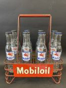 A good Mobiloil eight division oil bottle crate containing eight correct bottles with good labels