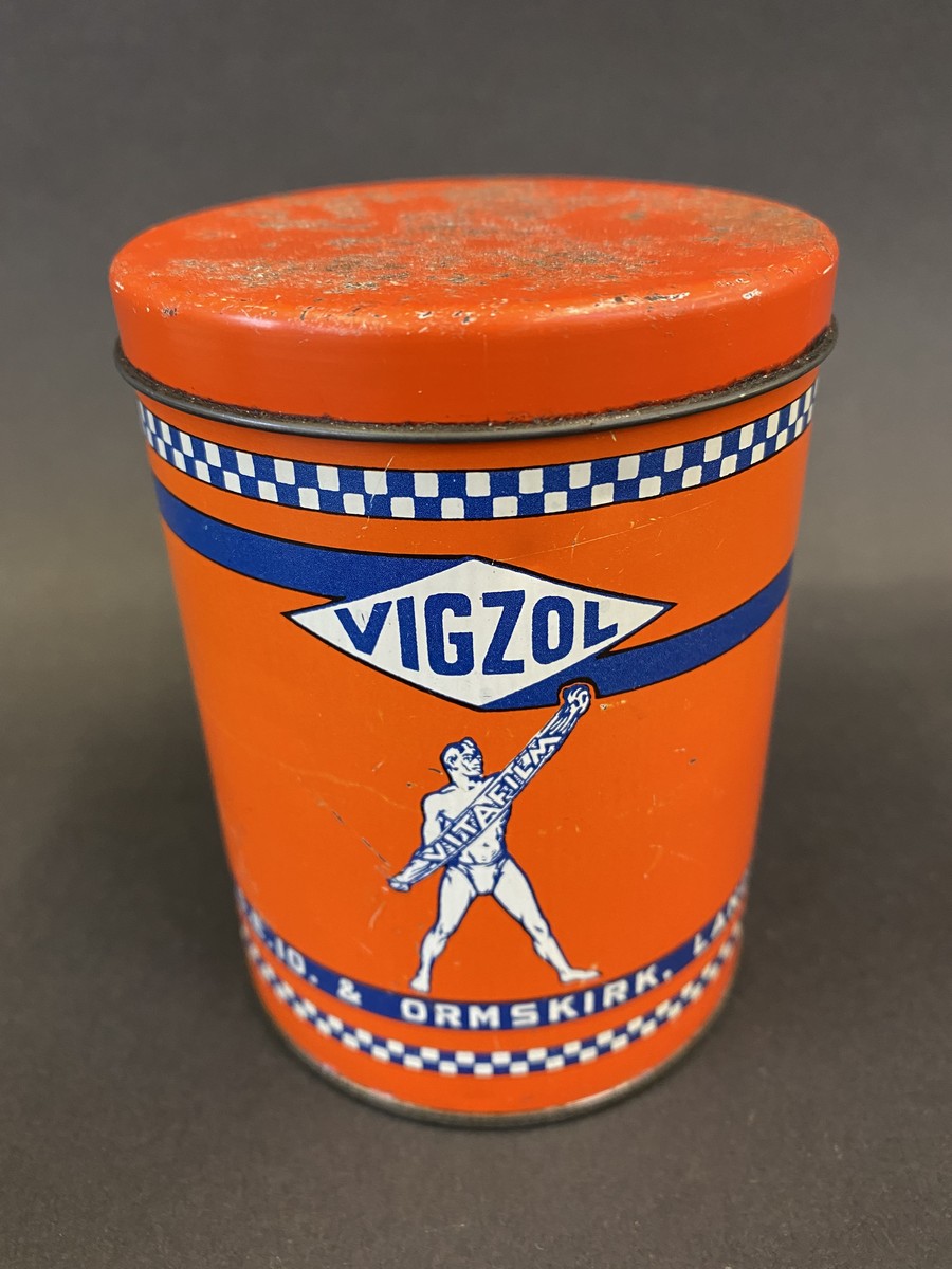 A Vigzol Grease tin.