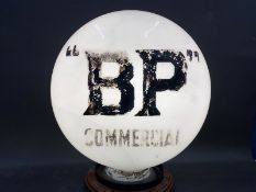 A BP Commercial pill shaped glass petrol pump globe, one side partly overpainted letters, narrow