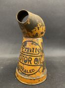 A Pratts Motor Oil 'Sealed' pint measure, dated 1931.