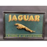 A contemporary and decorative Jaguar wooden advertising sign, 35 x 23".