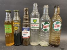 Three quart oil bottles and three pint versions, Castrol, BP and Esso.