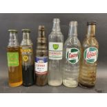 Three quart oil bottles and three pint versions, Castrol, BP and Esso.