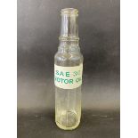 An unusual pint oil bottle bearing a label for SAE 30 Motor Oil.