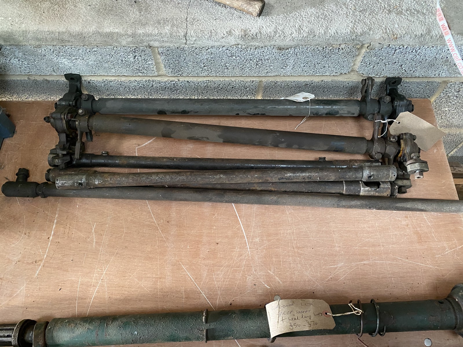 A bundle of Lagonda brake cross shafts and steering rods.