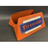 A Firestone tyre stand for a garage forecourt.