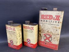 A Redex gallon can and two Redex quart cans.