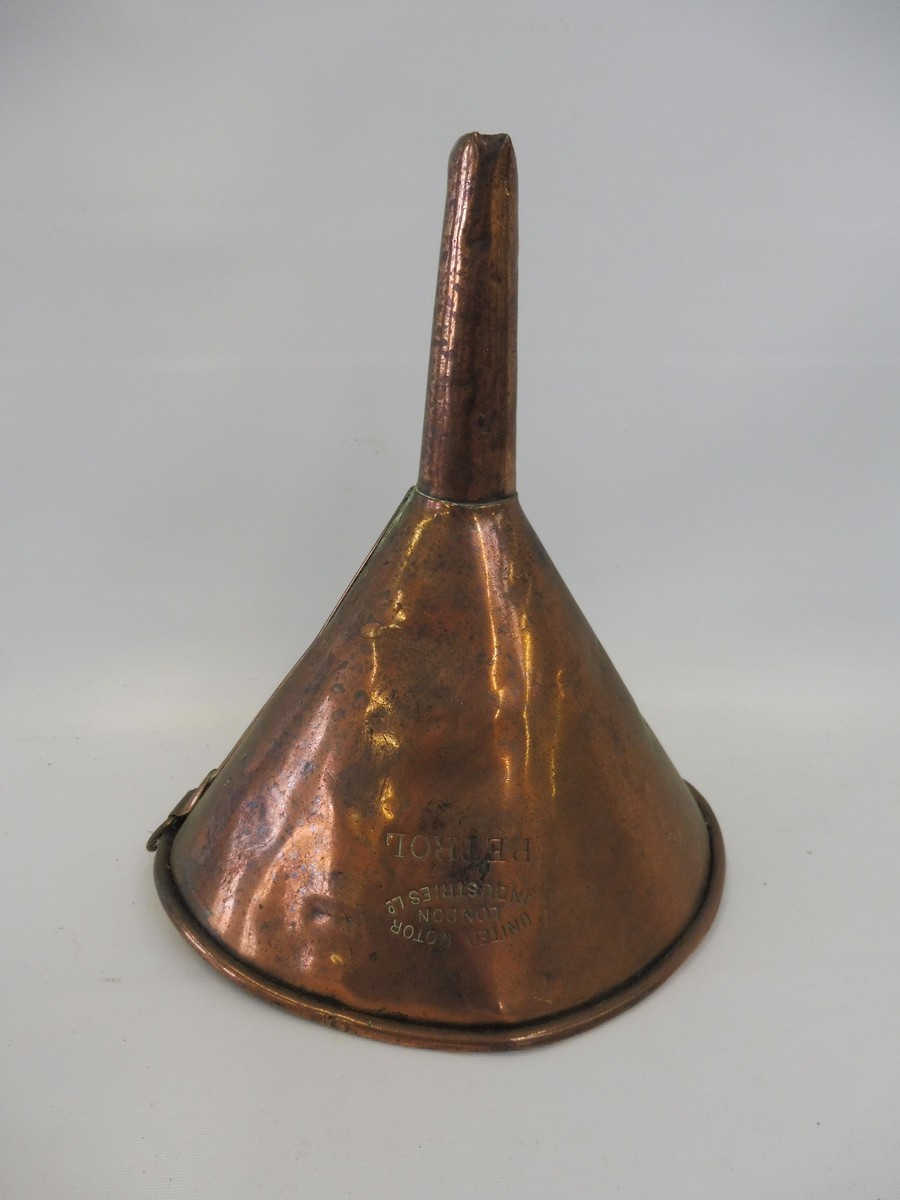 A United Motor Industries Ltd. of London copper funnel, stamped 'Petrol'.