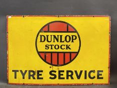 A Dunlop Stock rectangular enamel sign in good condition, 30 x 20".