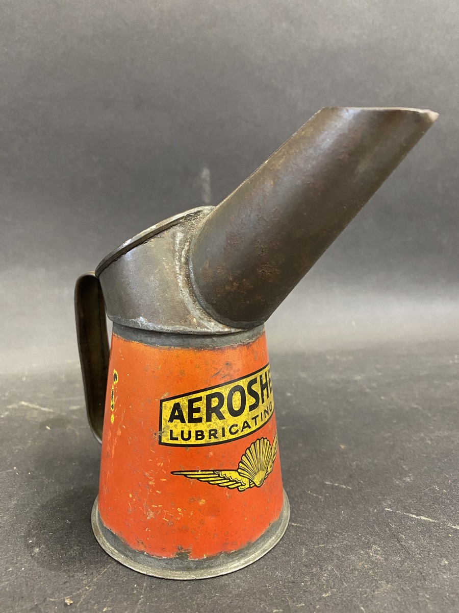 A rare Aeroshell Lubricating Oil half pint measure in good condition.