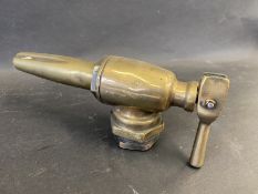 A small bronze petrol pump nozzle.