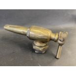 A small bronze petrol pump nozzle.