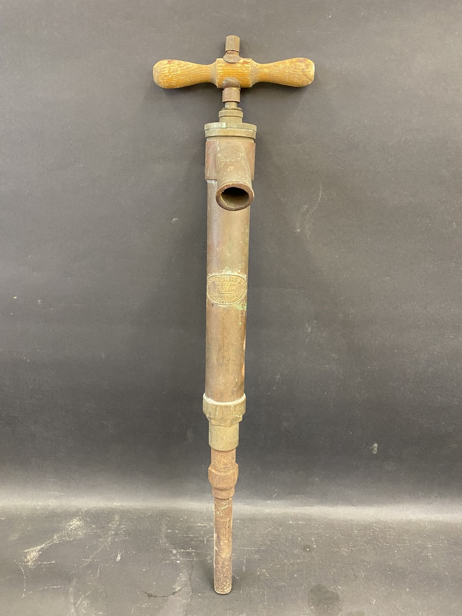 An unusual brass fuel pump probably for private use, bearing the name 'Abbott, Birks & Co. Pattern