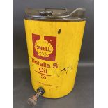 A Shell Rotella 'S' Oil five gallon drum with dispensing tap.