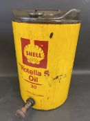 A Shell Rotella 'S' Oil five gallon drum with dispensing tap.