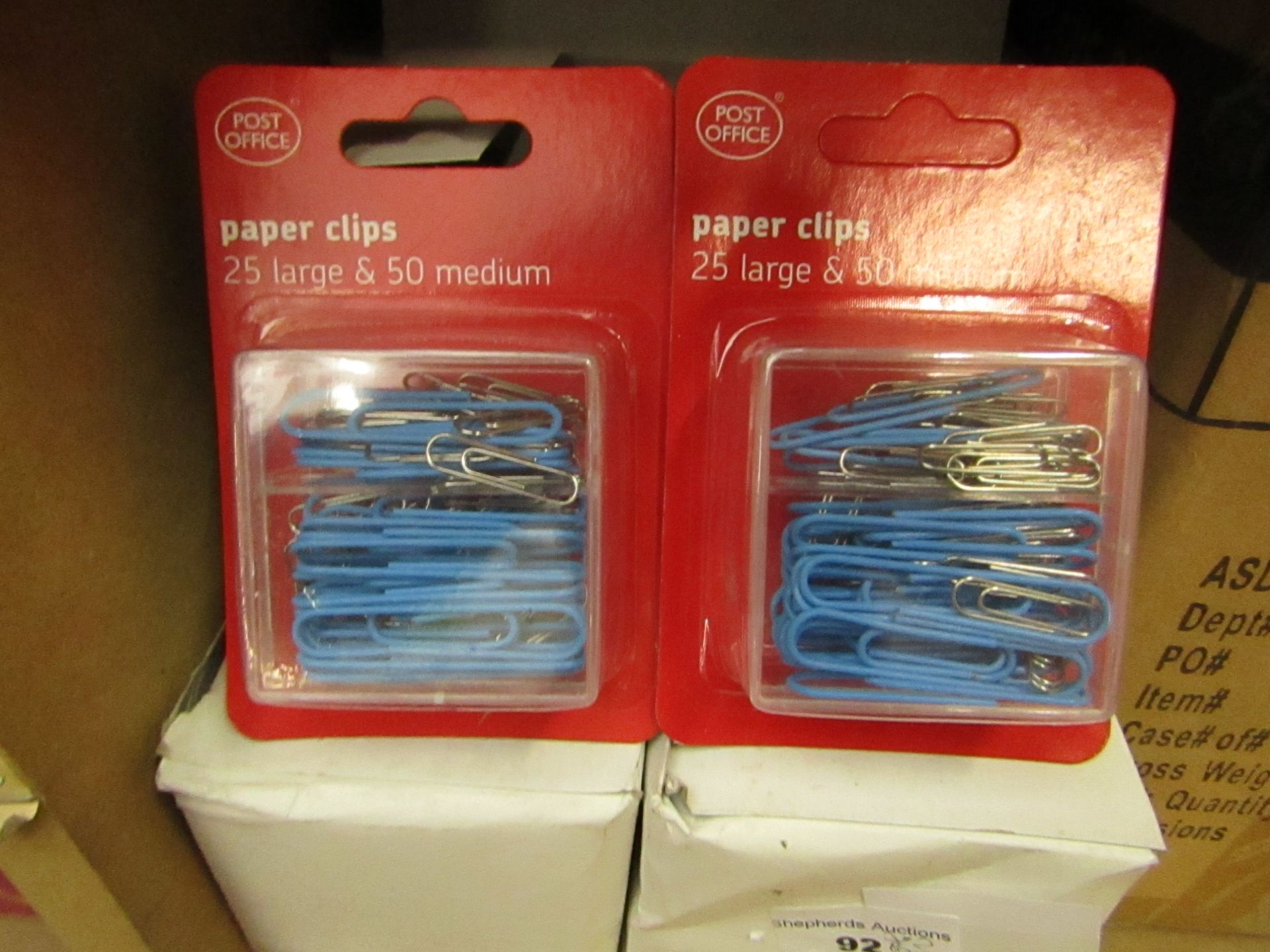 12x Post Office paper clips, new and packaged.