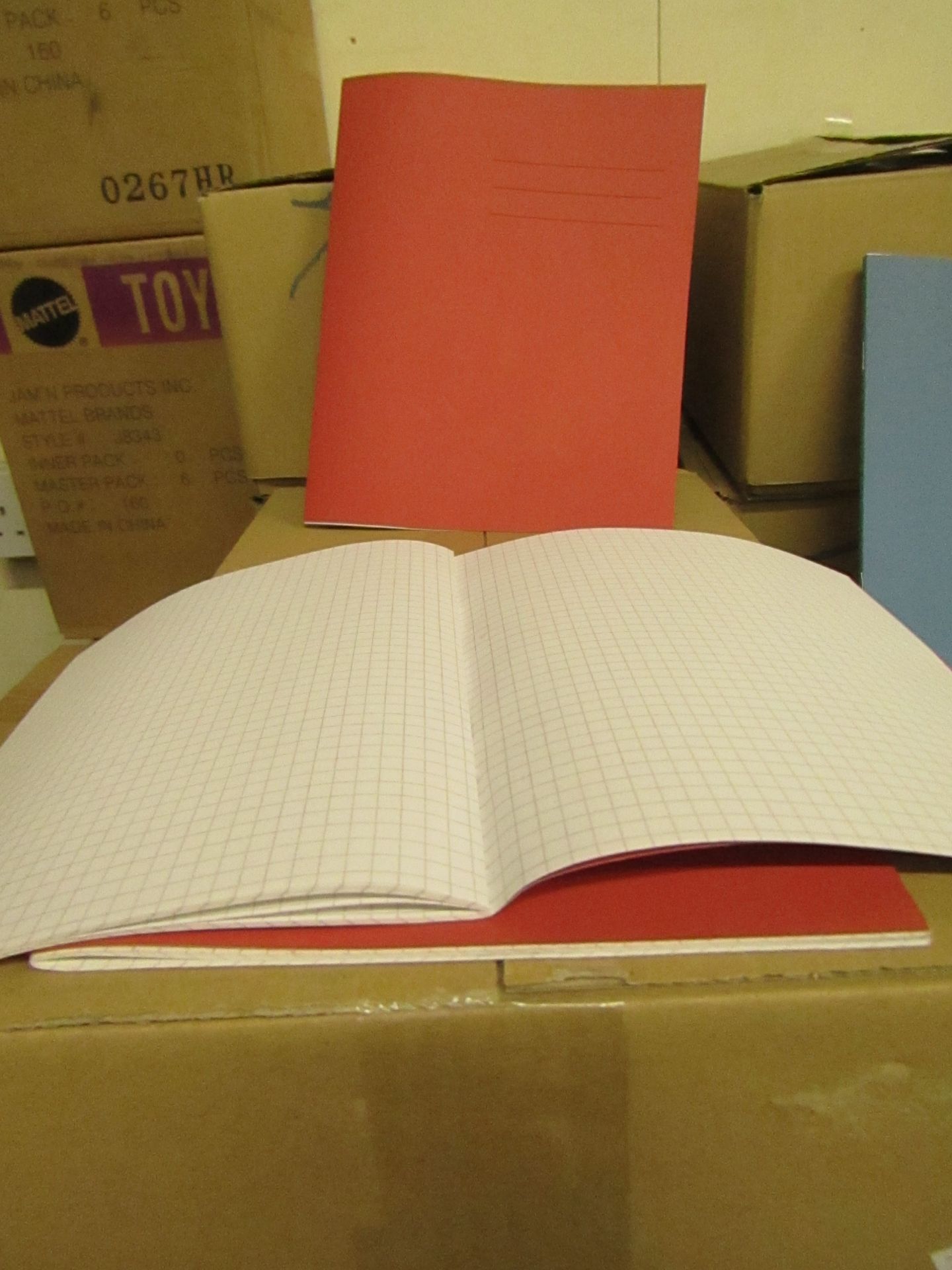 Box of 100 Red work books - all new and boxed.