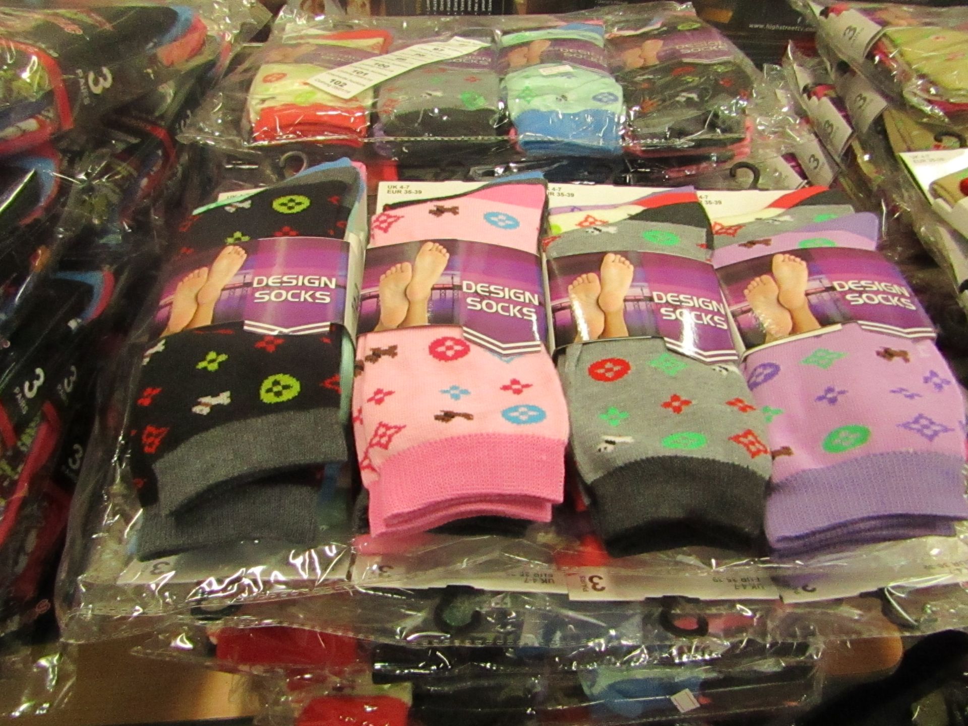 Pack of 12 x pairs Ladies Design Socks size 4-7 all new in packaging see image for design