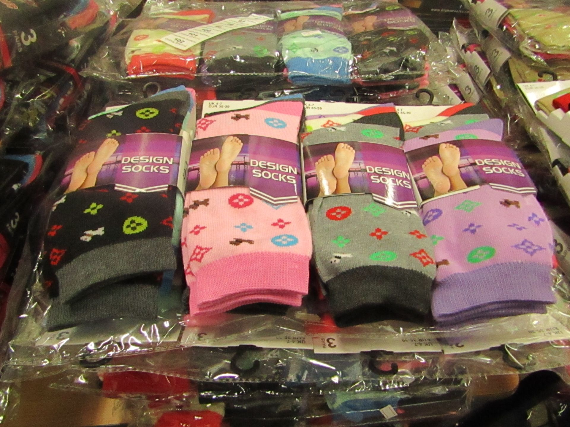 Pack of 12 x pairs Ladies Design Socks size 4-7 all new in packaging see image for design