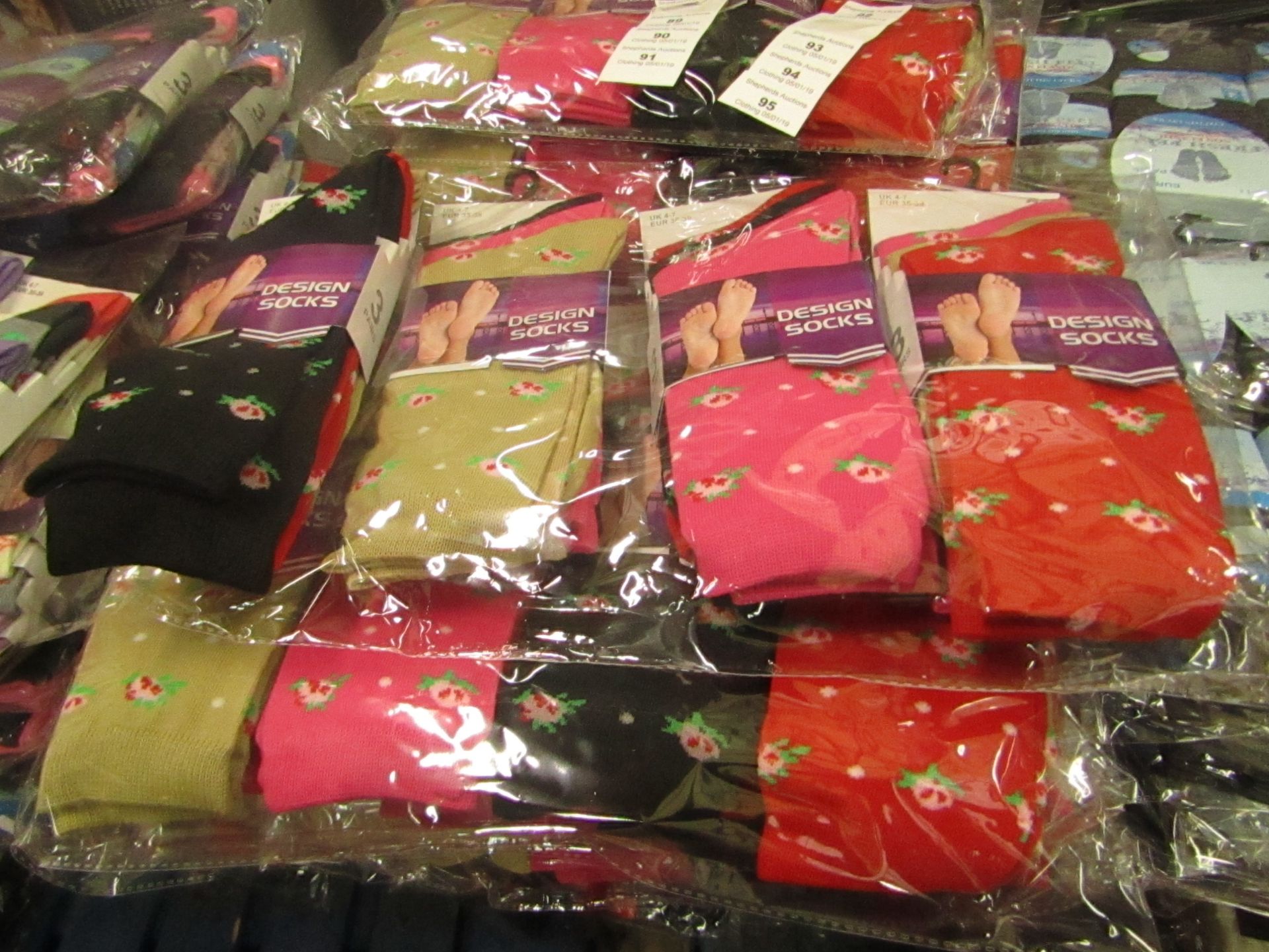 Pack of 12 x pairs Ladies Design Socks size 4-7 all new in packaging see image for design