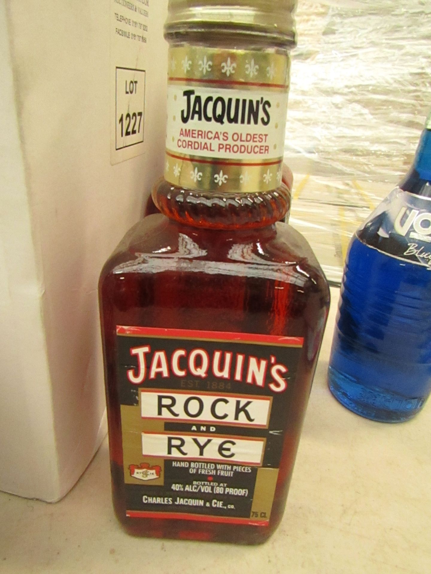 Jacquins Rock & Rye. Hand Bottled with Pieces of Fresh Fruit. 40% vol. 70cl. Bottle is market but