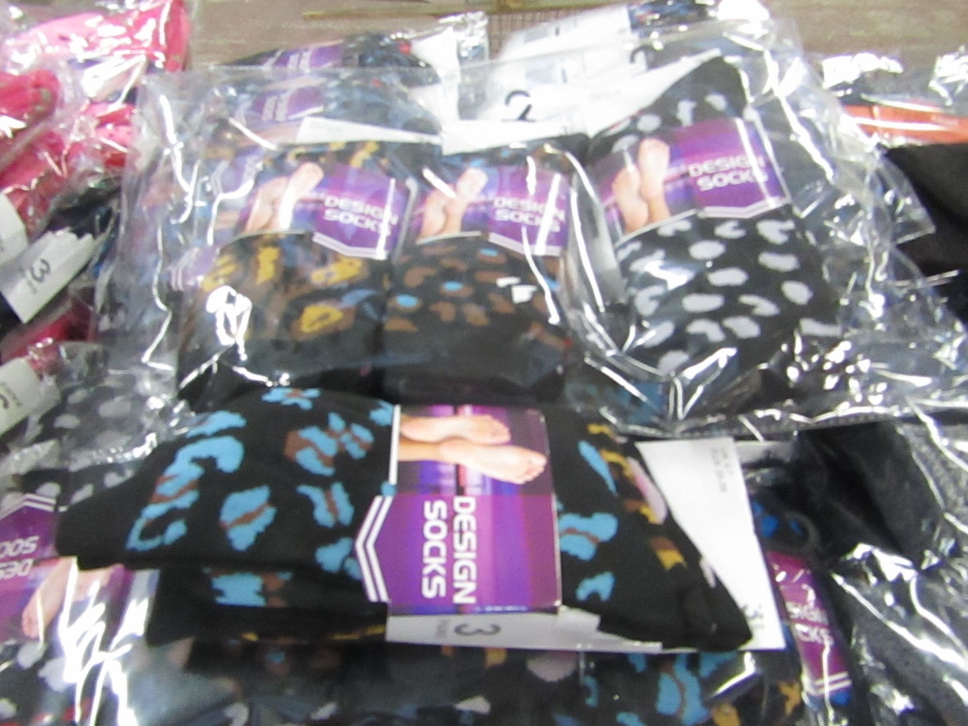 12 X Pairs of Ladies Design Socks size 4-7 new in packaging
