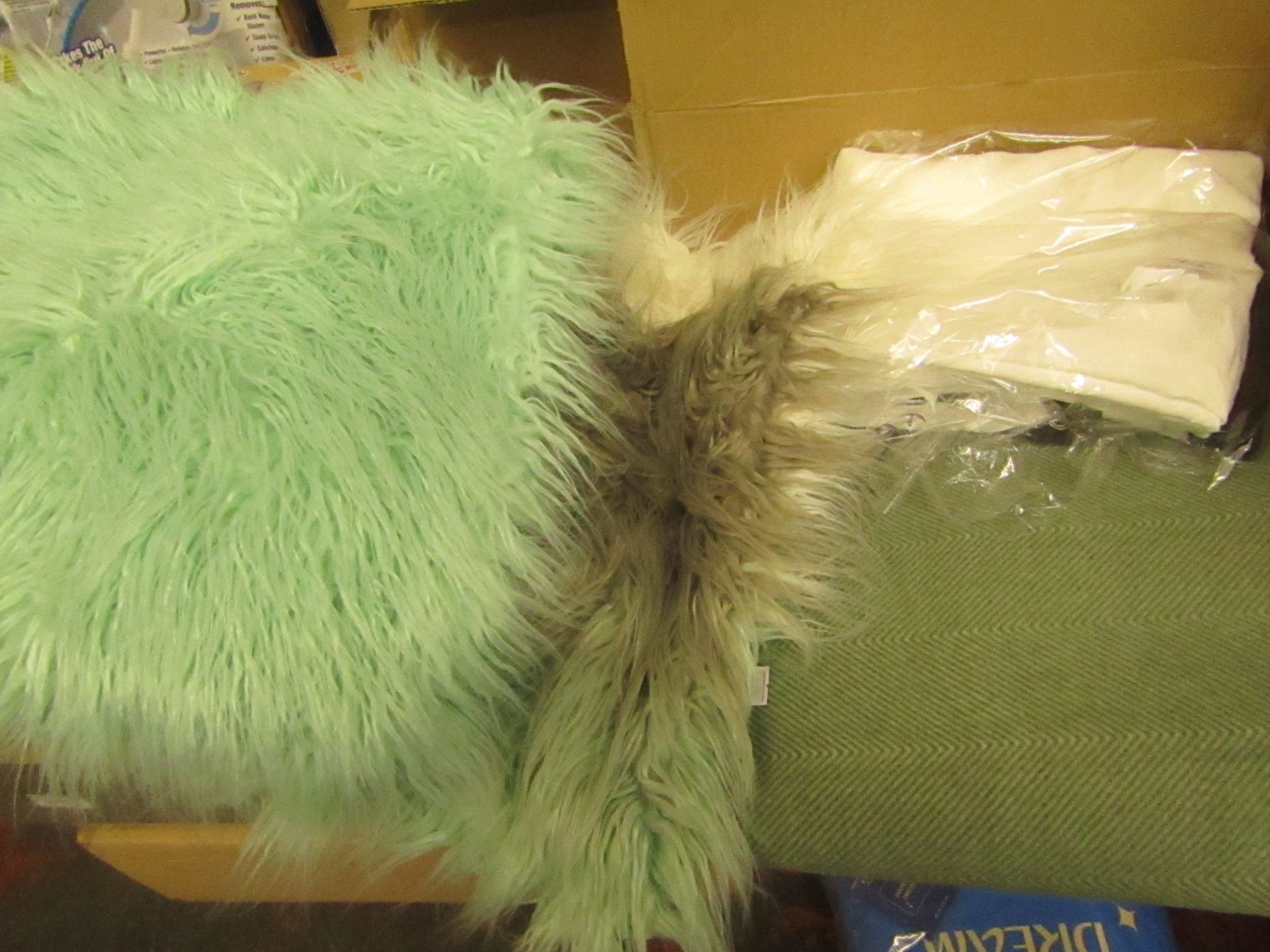 4 Items being 2 Cushion Covers, a Green Blanket & a Waterproof cover
