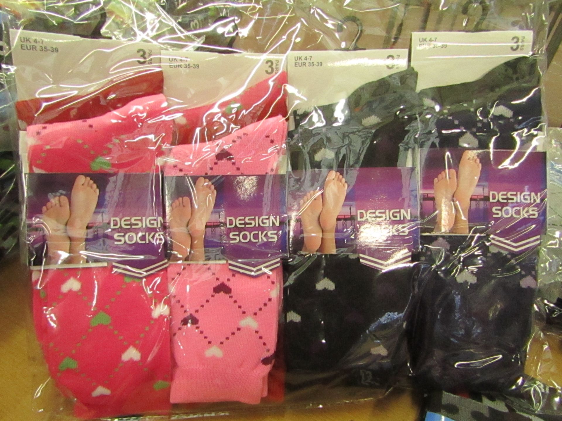 12 X Pairs of Ladies Design Socks size 4-7 new in packaging