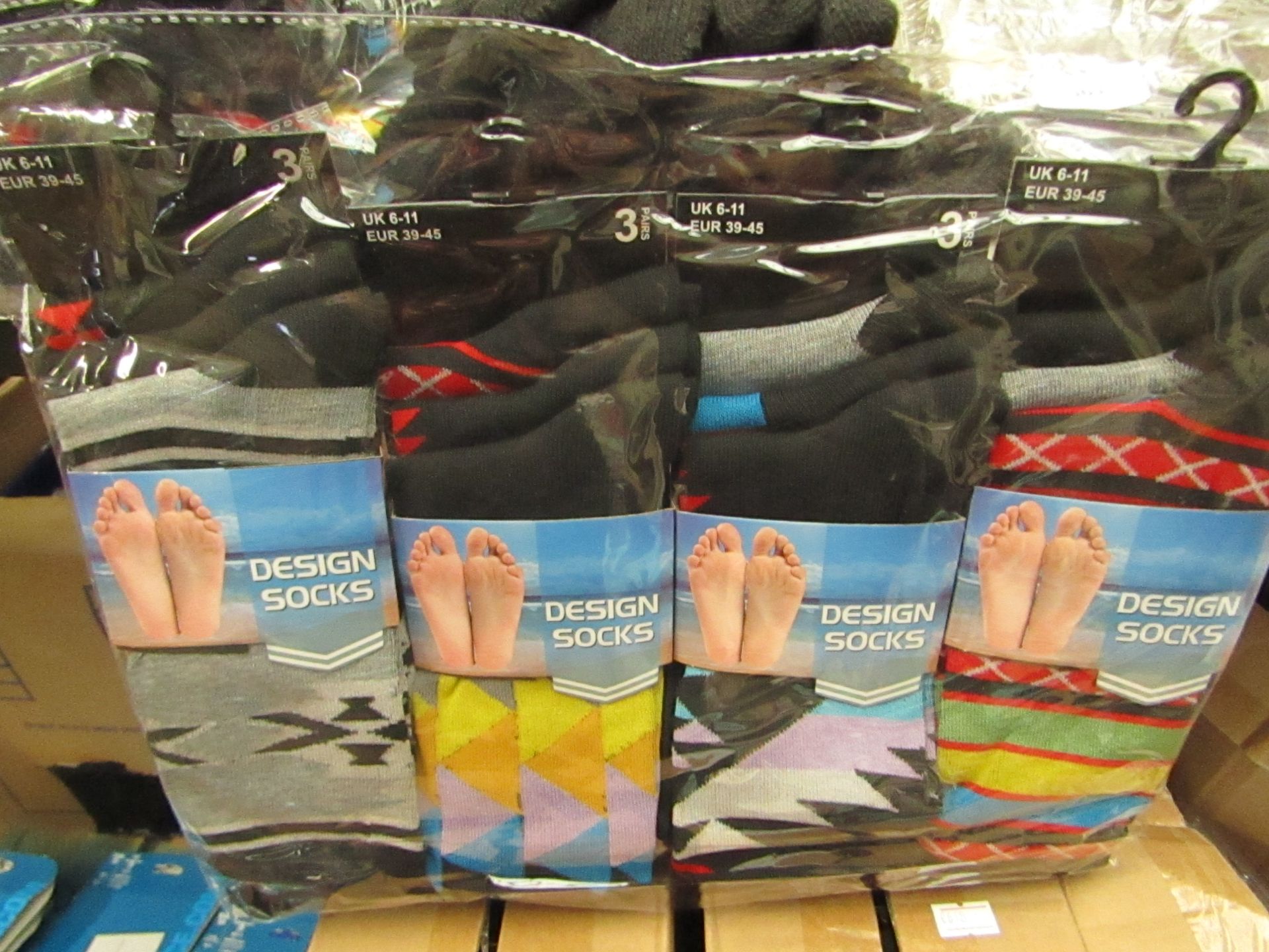 12 Pairs on Mens Design Socks. Size 6 - 11. New & Packaged