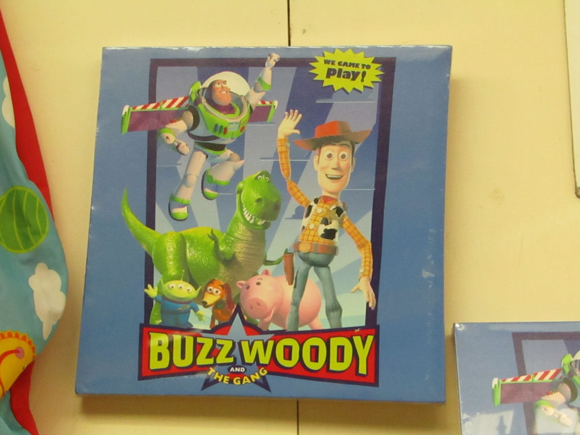 Box of 12 Buzz, Woody & the Gang Canvas Prints. 30cm x 30cm. New & Boxed