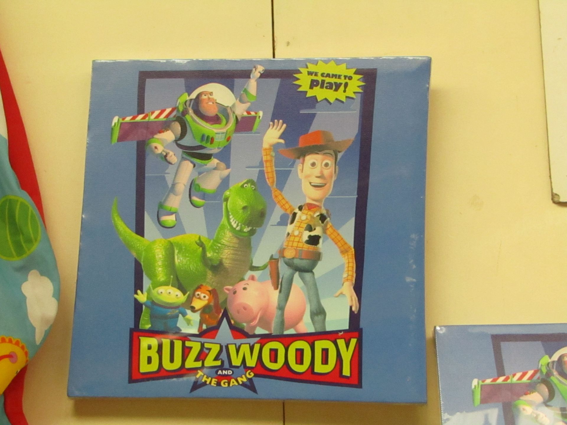 Box of 12 Buzz, Woody & the Gang Canvas Prints. 30cm x 30cm. New & Boxed