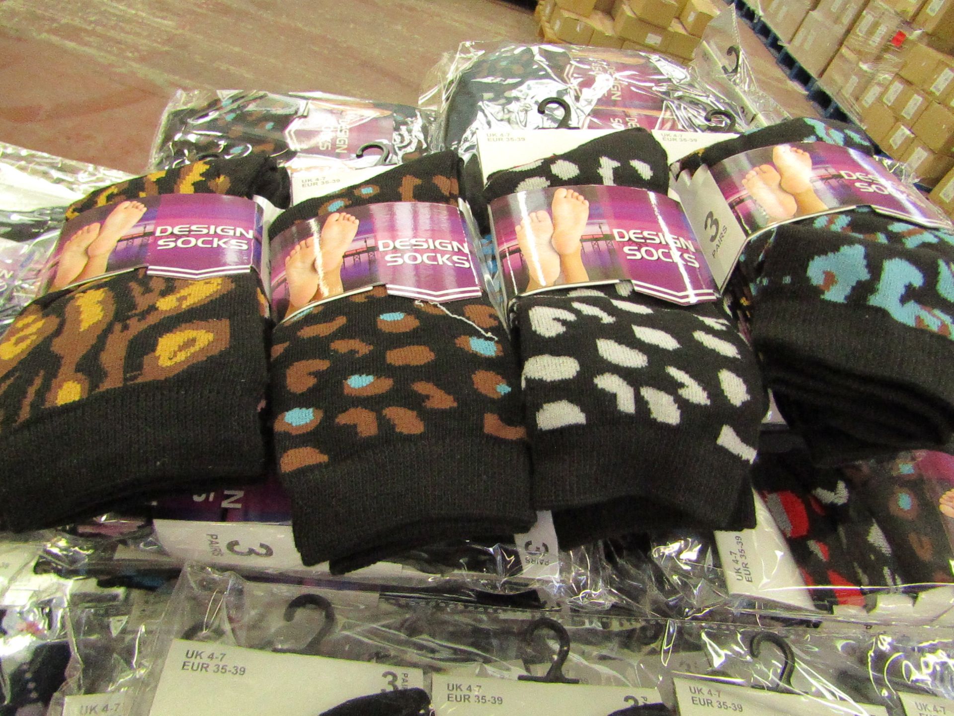 12 X Pairs of Ladies Design Socks size 4-7 new in packaging