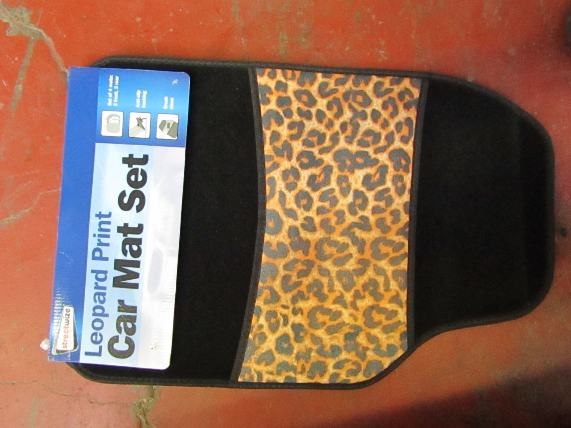 Set of 4 leopard print car mats, new and packaged.