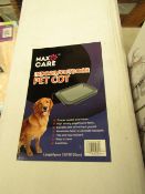 Max Care indoor and outdoor pet cot, new and boxed.