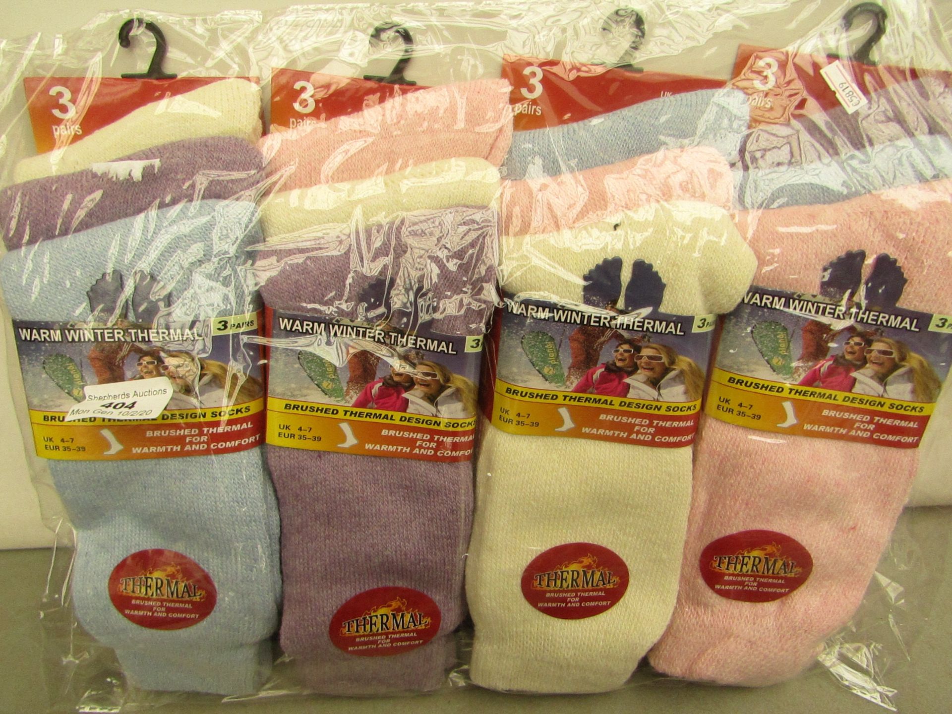 12x Pairs of warm winter thermal socks, size 4-7, new and packaged.