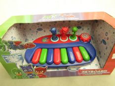 PJ Masks keyboard, new and in damaged packaging.