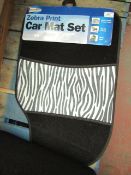 Set of 4 universal car mats, see picture for design, new and packaged.