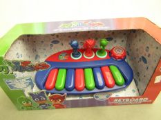 PJ Masks keyboard, new and in damaged packaging.