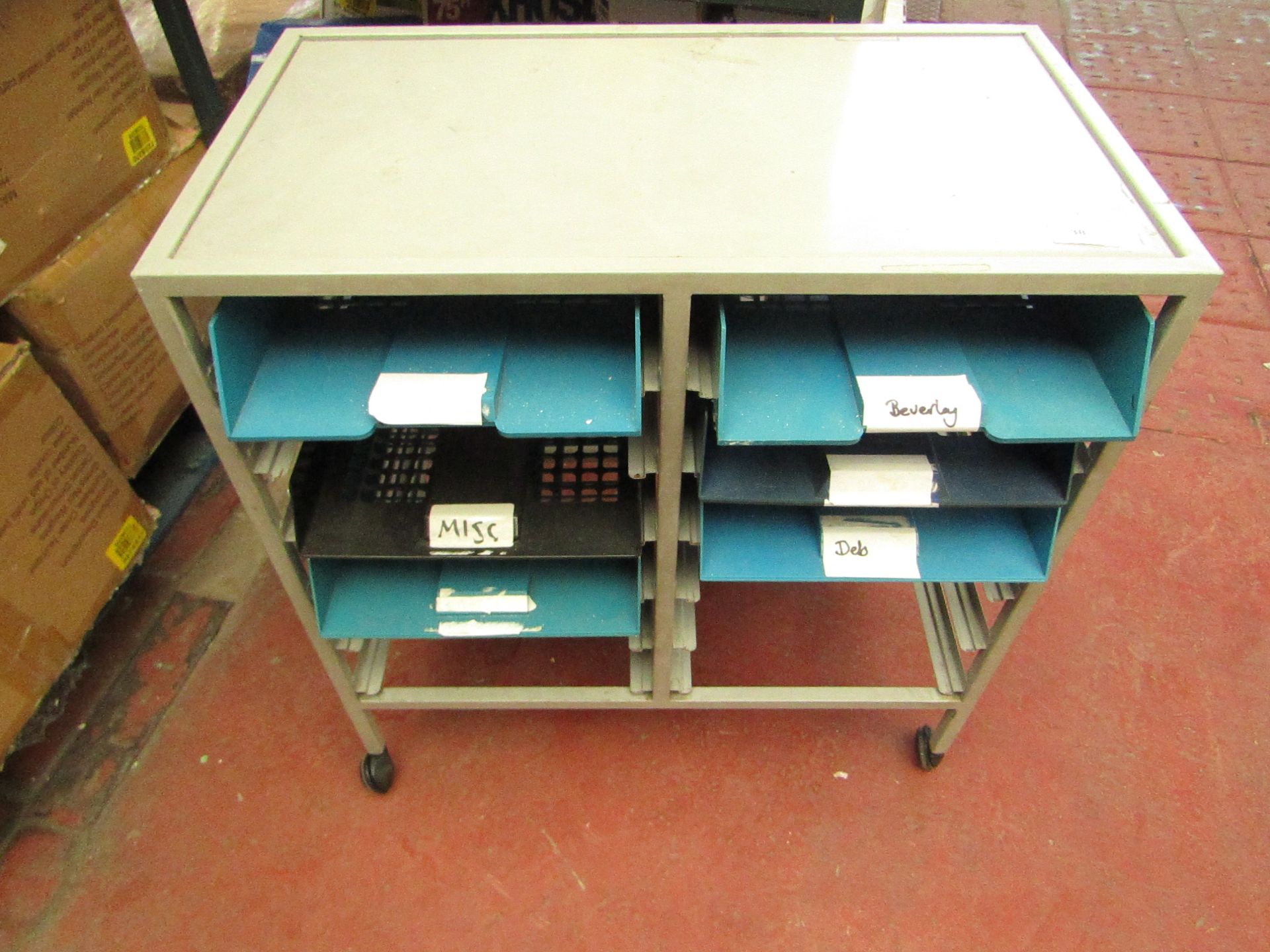 Metal unit on wheels with 6 pull out trays. Has been used but is stillperfectly usable