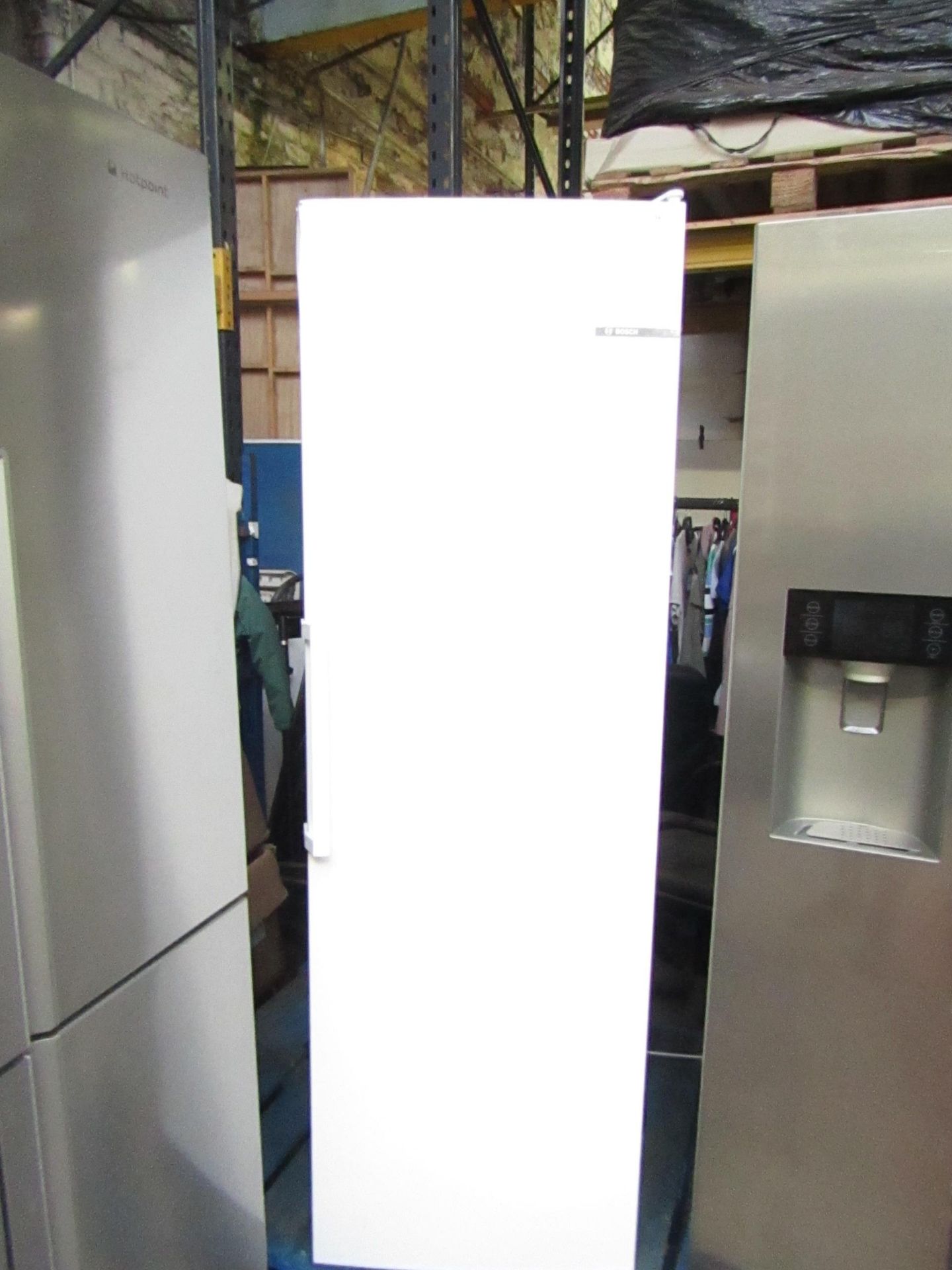 Bosch Freestanding tall freezer, Tested working but has damage to the top of the door, does not