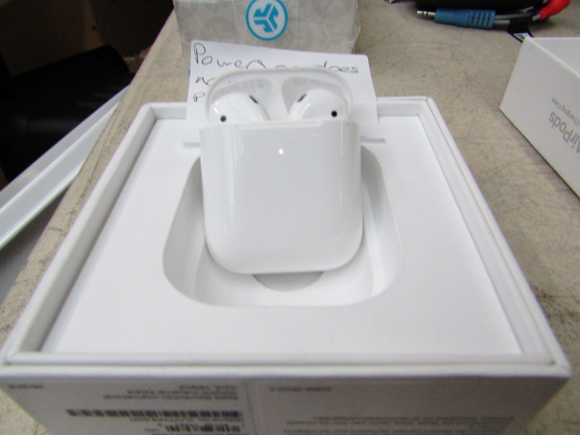 Apple - AirPods, with Wireless Charging Case - Powers on but does not connect to iPhone. Boxed.