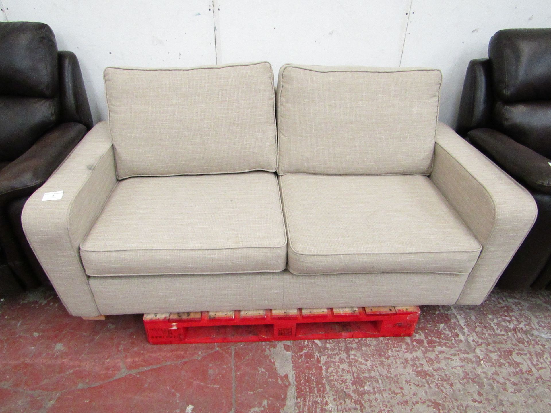 Beige fabric 2 seater sofa, in good condition but has a few dirty parts from storage, should clean